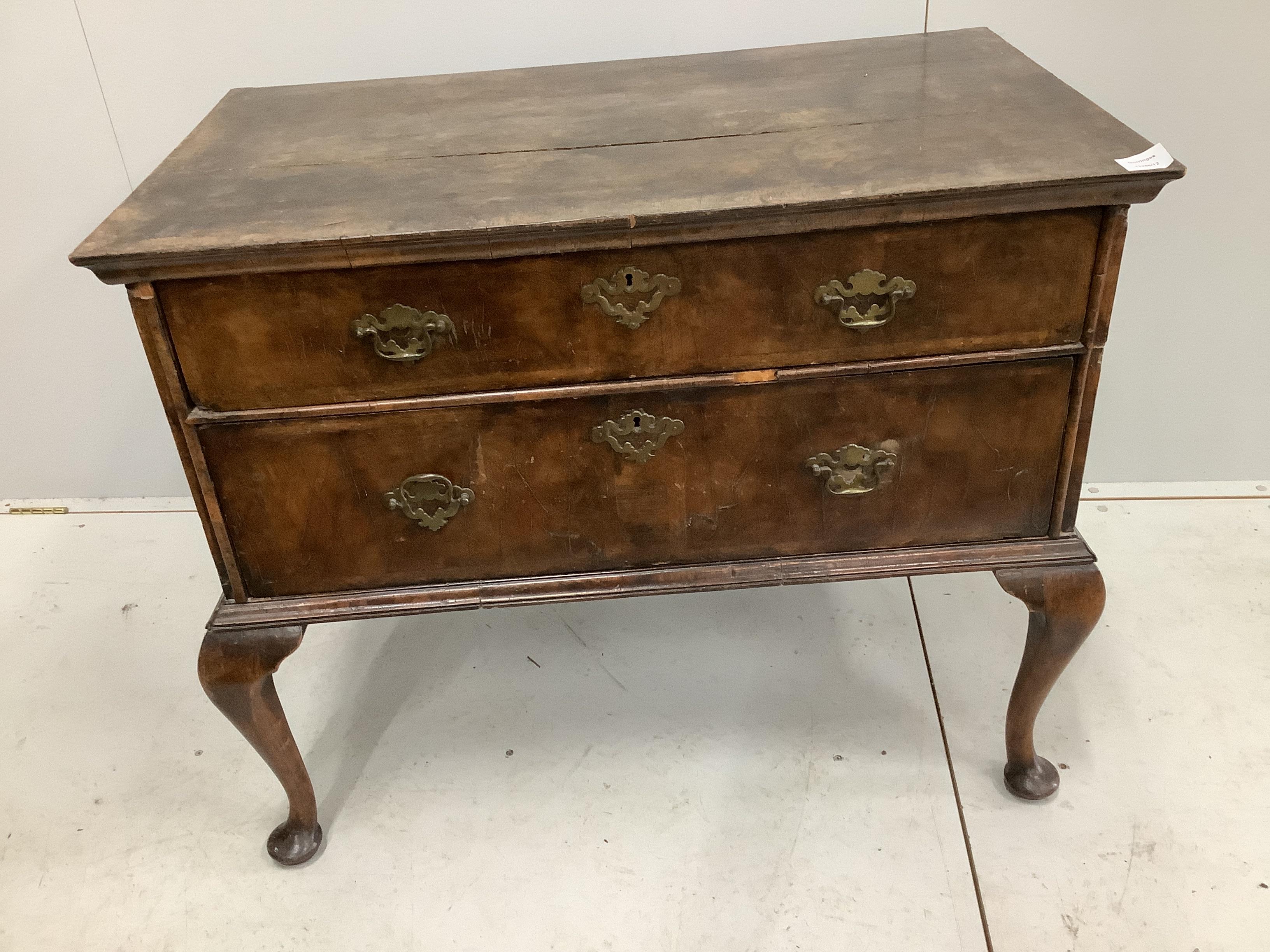 A Queen Anne banded walnut two drawer chest, adapted from a stand, width 96cm, depth 56cm, height 80cm. Condition - poor